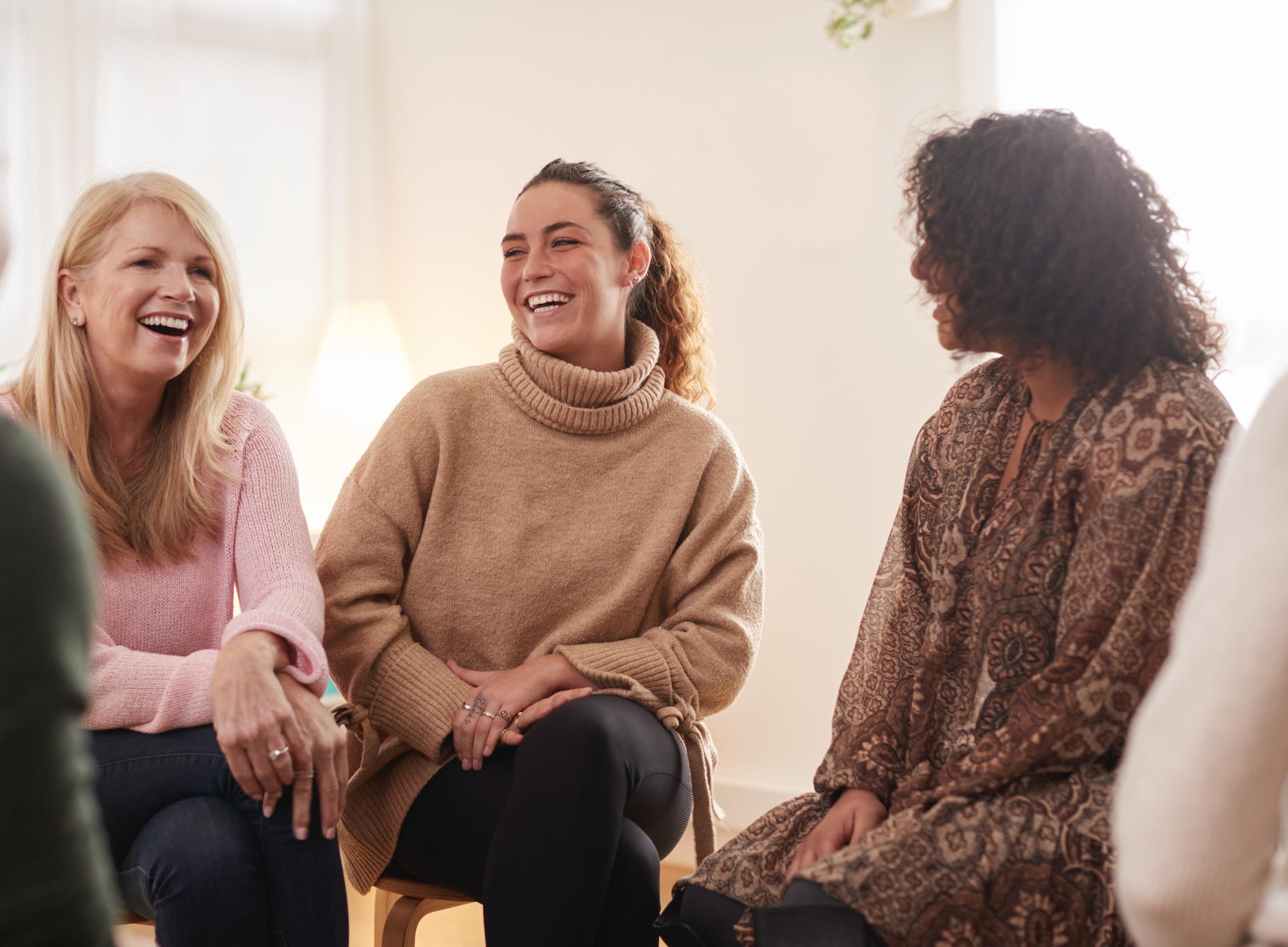 group of 3 women laughing